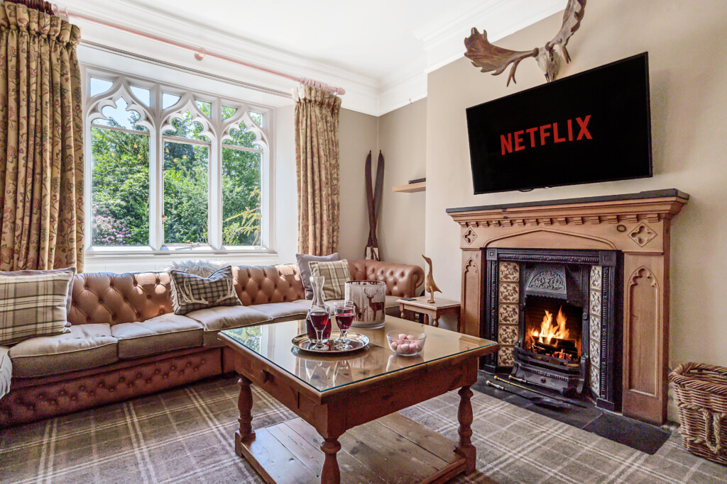 Alice Howe lounge in this big house in the Lakes seats up to 14 on huge Chesterfield sofas.